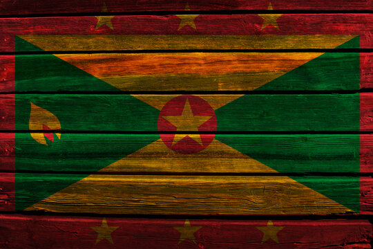 3D Flag of Grenada on a old wood wall background.