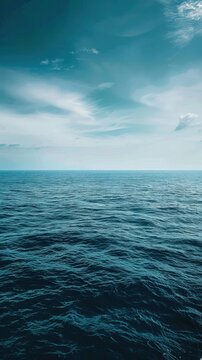 Calm Ocean Waters Under a Blue Sky