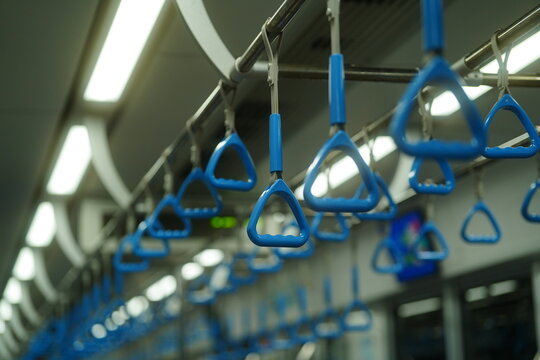 Hand straps inside a modern metro train