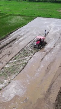 Vertical Aerial View of Indian Farmers Preparing Paddy Fields in Rural India