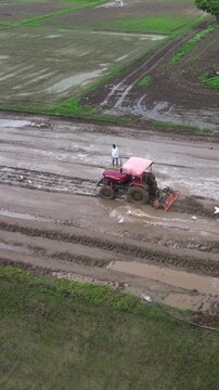 Vertical Aerial View of Indian Farmers Preparing Paddy Fields in Rural India