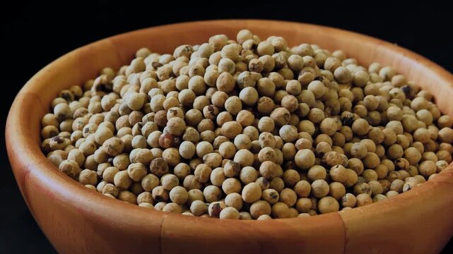 Peppercorns in a Wooden Bowl