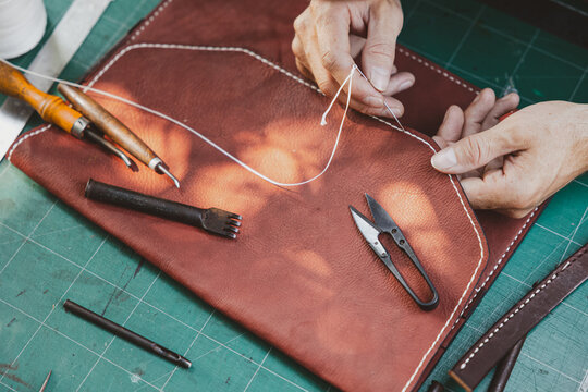 Leather Craftsman Stitching Handmade Bag In Artisan Leathercraft Workshop Workshop