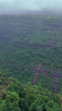 Vertical Aerial View of Lonavala Waterfall and Misty Green Hills During Monsoon Maharashtra