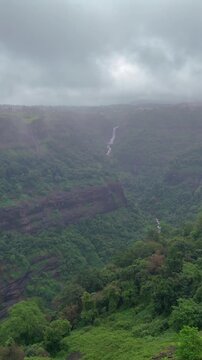 Vertical Aerial View of Lonavala Waterfall and Misty Green Hills During Monsoon Maharashtra