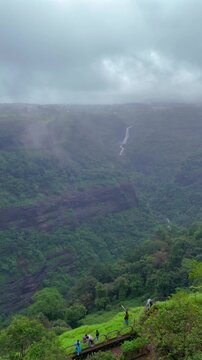 Vertical Aerial View of Lonavala Waterfall and Misty Green Hills During Monsoon Maharashtra