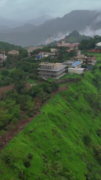 Vertical Aerial View of Lonavala Waterfall and Misty Green Hills During Monsoon Maharashtra