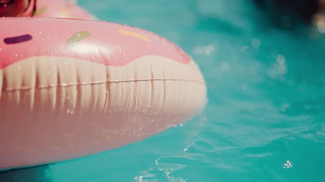 Floating donut in a swimming pool on a sunny day