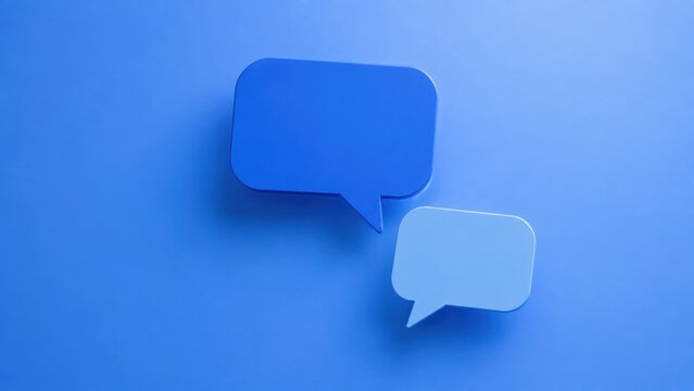 Two simple blue and light blue speech bubbles on a plain blue background, conveying conversation and ideas.