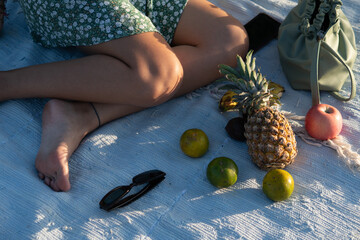 Relaxing summer beach picnic aesthetic with fresh fruits and sunglasses © Agus