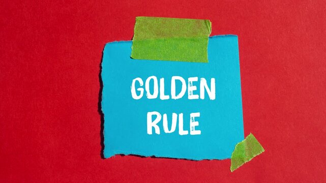 Golden rule message writing on ripped torn paper background