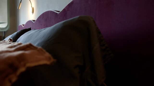 Designer Bed With Upholstered Headboard In Bedroom