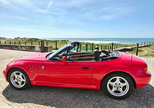 BMW Z3 convertible car parked near ocean coast