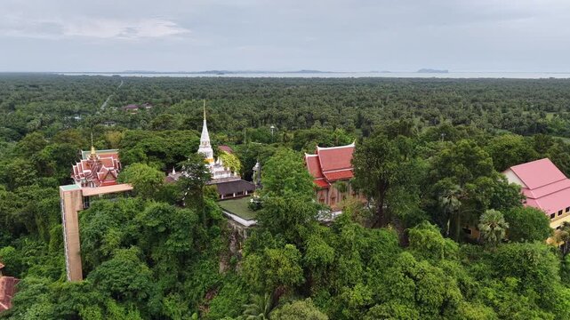 An aerial view of Wat Phra Kho in Songkhla province captured by a drone camera during the daytime.