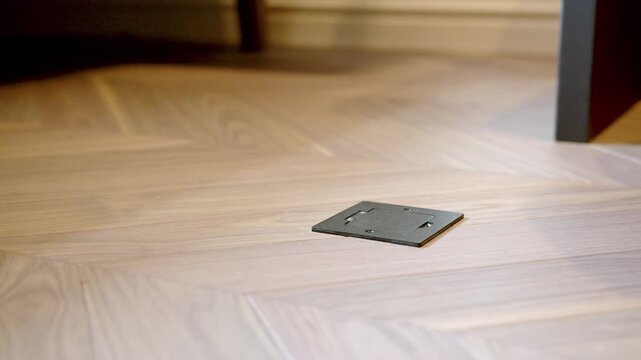 Electrical Floor Outlet In Wooden Parquet Flooring