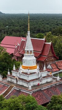 An aerial view of Wat Phra Kho in Songkhla province captured by a drone camera during the daytime.