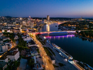 Fototapeta premium View of Belgrade at night from a drone. View of the Belgrade waterfront at night
