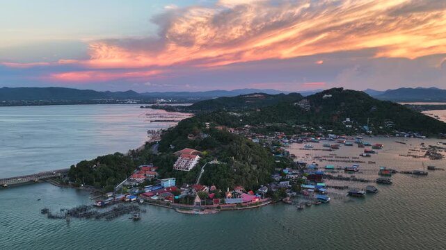 An aerial view of Koh Yor island in Songkhla province during a vibrant sunset.