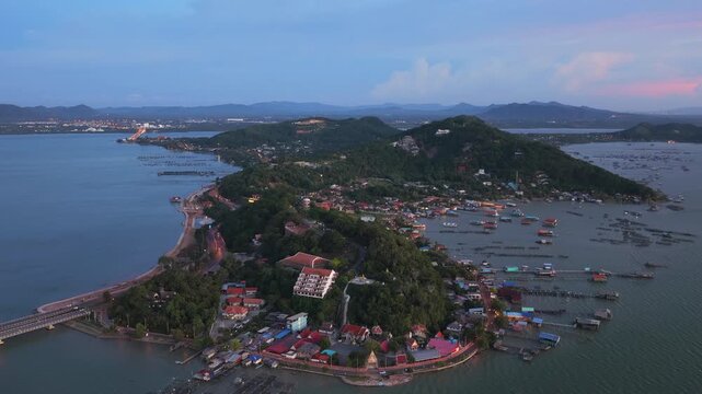 An aerial view of Koh Yor island in Songkhla province during a vibrant sunset.