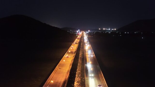An aerial view of the Tinsulanonda Bridge in Songkhla province at night.