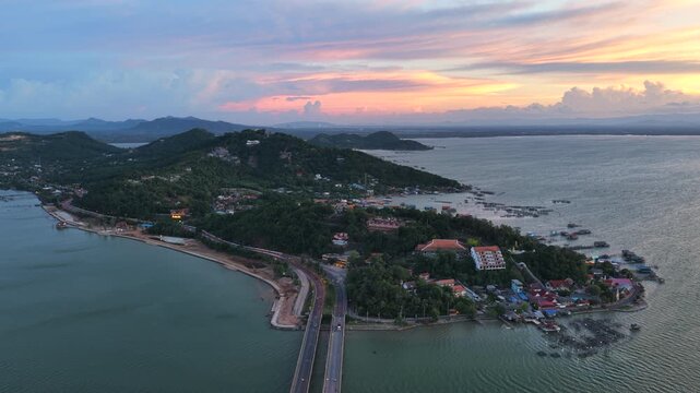 An aerial view of Koh Yor island in Songkhla province during a vibrant sunset.