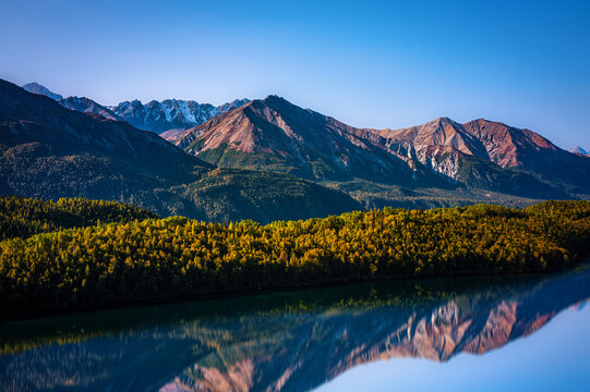 Alaska Autumn Roadside Landscape and water reflection at Matanuska Glacier and River in Chugach Mountain Range along Glenn Highway Scenic Byway, USA
