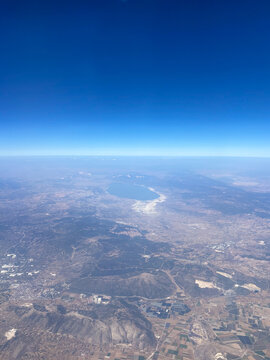 High altitude aerial view of rural landscape and water in Turkey.