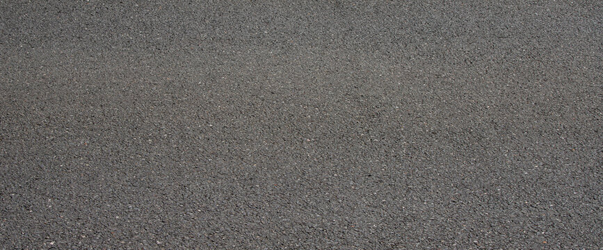 smooth dark asphalt road surface texture wide banner background