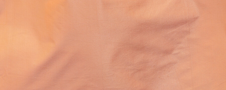 peach orange fine mesh fabric texture background wavy moire pattern banner