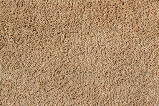 beige carpet fiber texture close up background soft fabric material