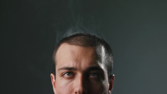 Young Man With Intense Alarmed Expression In Close Up Portrait