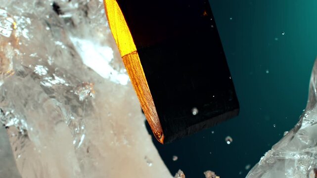 Ice being shattered by an ice pick in extreme macro close-up, capturing sharp cracks, flying ice fragments and sparkling frozen textures in dramatic slow motion.