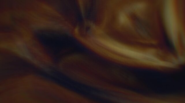 Cosmic energy waves billow across deep void in a dramatic 3D animation featuring warm bronze gradients and fluid motion ideal for atmospheric scifi backdrops