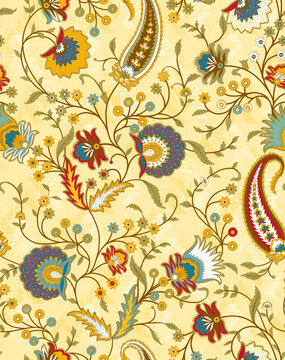 Seamless ethnic floral pattern featuring intricate paisley and chintz motifs in yellow, teal, and crimson red over a soft pale yellow background.