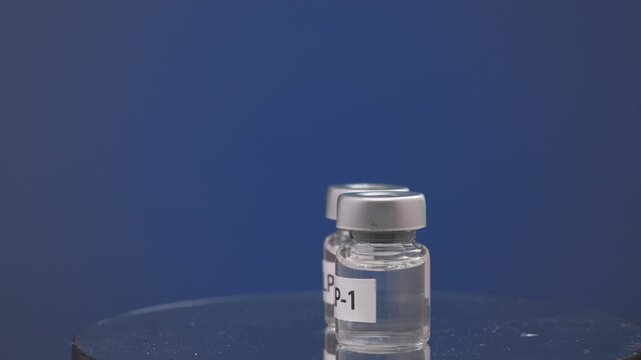 Hopeful glp1 injection vial medicine solution offers modern health treatment therapy inside clear glass bottle for clinical care