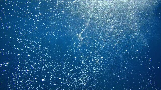 Bubbles under the sea in the crystal clear green sea water. Mediterranean bubbles. Real image very suitable for backgrounds, Rising Bubbles in Deep Underwater, Under with bubble. Great for background.