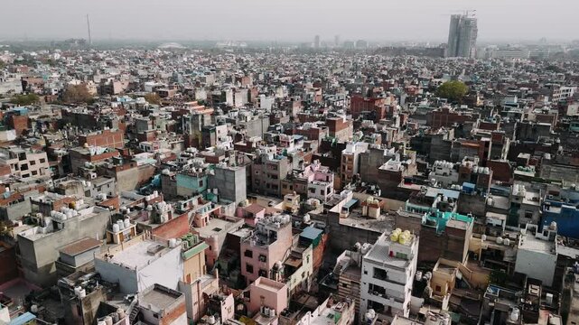 Aerial view of delhi cityscape showing urban poverty, dense housing, and overpopulation in a slum district of india