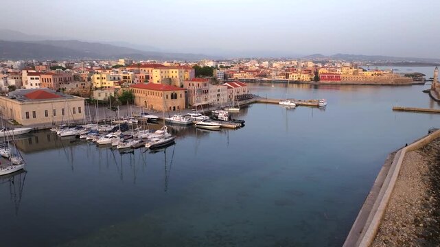 Beautiful Old city, Greece and best scenic places - panorama of picturesque old town Chania. Crete island, Panoramic of the old Venetian port and lighthouse during the blue hour, Travel Concepts
