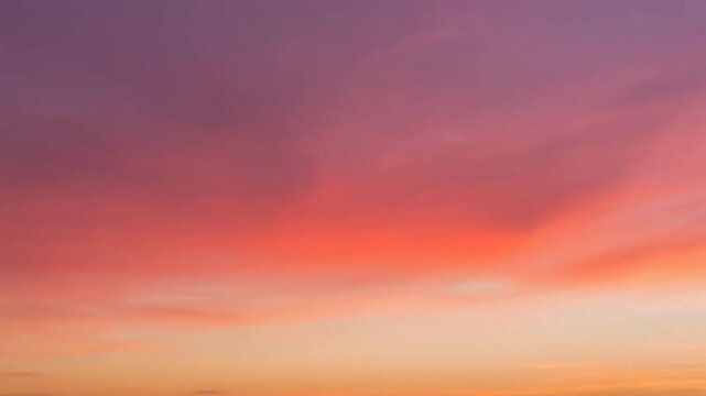 A vibrant sunset sky displays gradients of purple, pink, and orange hues at dusk.