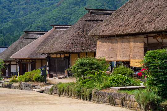 Historic streetscape of Ouchi-juku lined with traditional thatched-roof houses in Fukushima