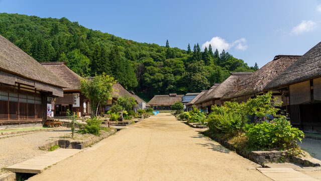 Historic streetscape of Ouchi-juku lined with traditional thatched-roof houses in Fukushima
