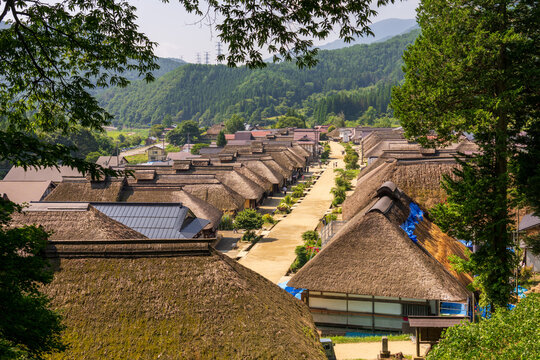 Historic streetscape of Ouchi-juku lined with traditional thatched-roof houses in Fukushima