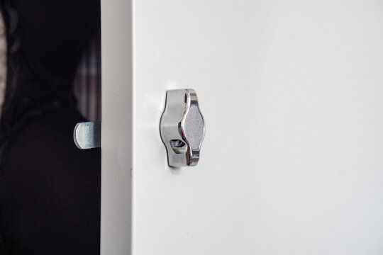 Handle-lock on an iron cabinet close up
