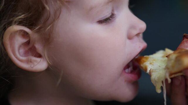 Little Girl Taking a Bite of Pizza &mdash; Three-Stage Eating Sequence