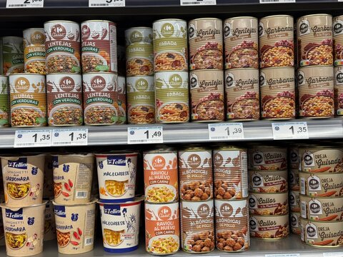 Mallorca, spain, august 30, 2026, supermarket shelf displaying variety of canned and instant ready meals for convenient shopping in andratx, spain