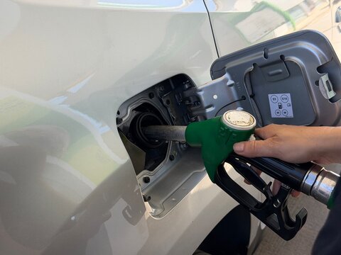 Mallorca, spain, august 30, 2026, person refueling car at gas station, pumping gasoline into vehicle tank, rising fuel prices concept in montuiri