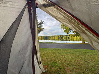 View from tent revealing stunning lakeside scene © Jaroslav Machacek
