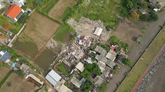 Slum Shack Village Near Sanur Beach East Bali Indonesia Drone Rise 4K 60FPS