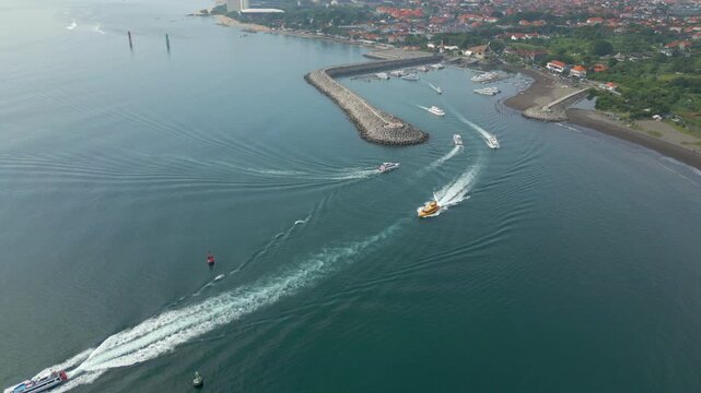 Tourist Boats Arriving Departing Sanur Port In Bali Indonesia Drone Birdseye Shot 4K 60FPS