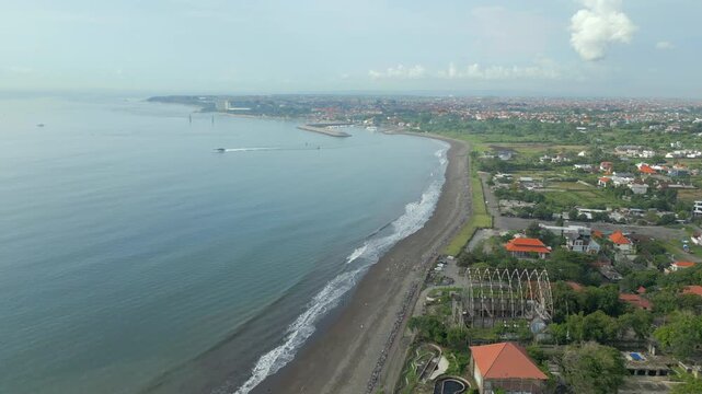 Boat Pulls Out Of Sanur Harbor Padang Galak Beach Bali Indonesia Drone Track In 4K 60FPS
